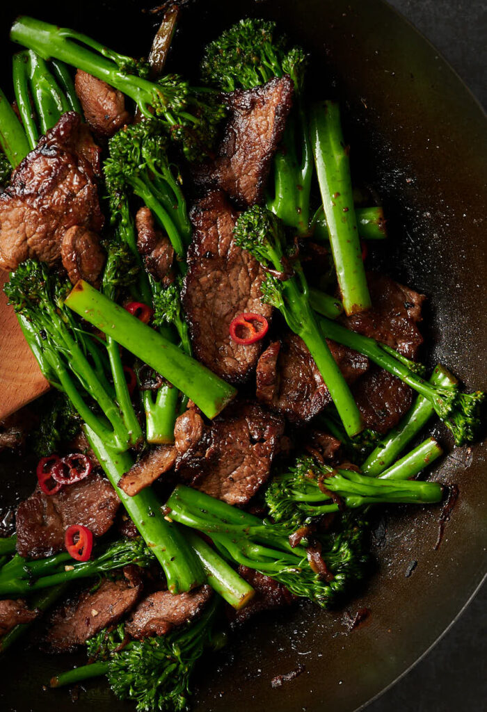Close up of Thai beef and broccoli in a wok.