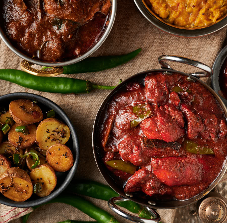 Naga chicken tikka curry in an Indian styled bowl from above.