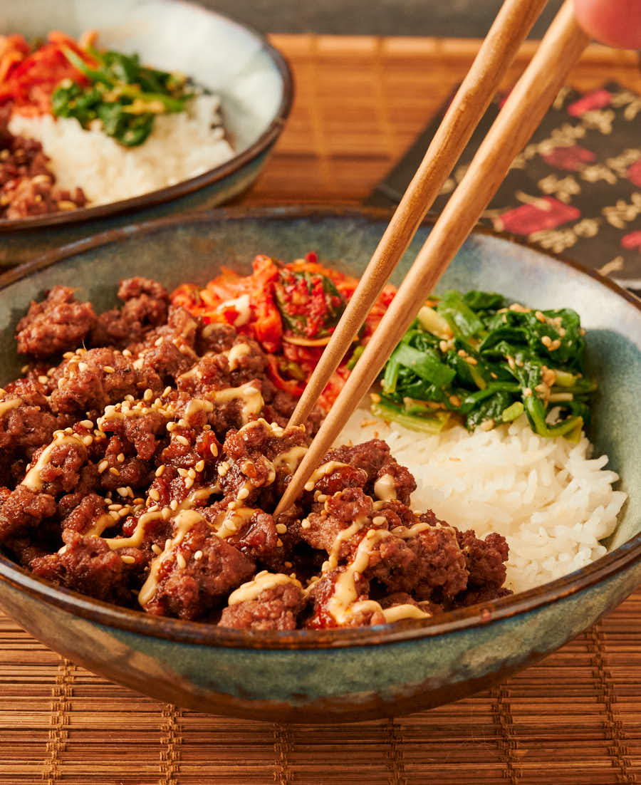 Korean beef bowl with chopsticks from the front.