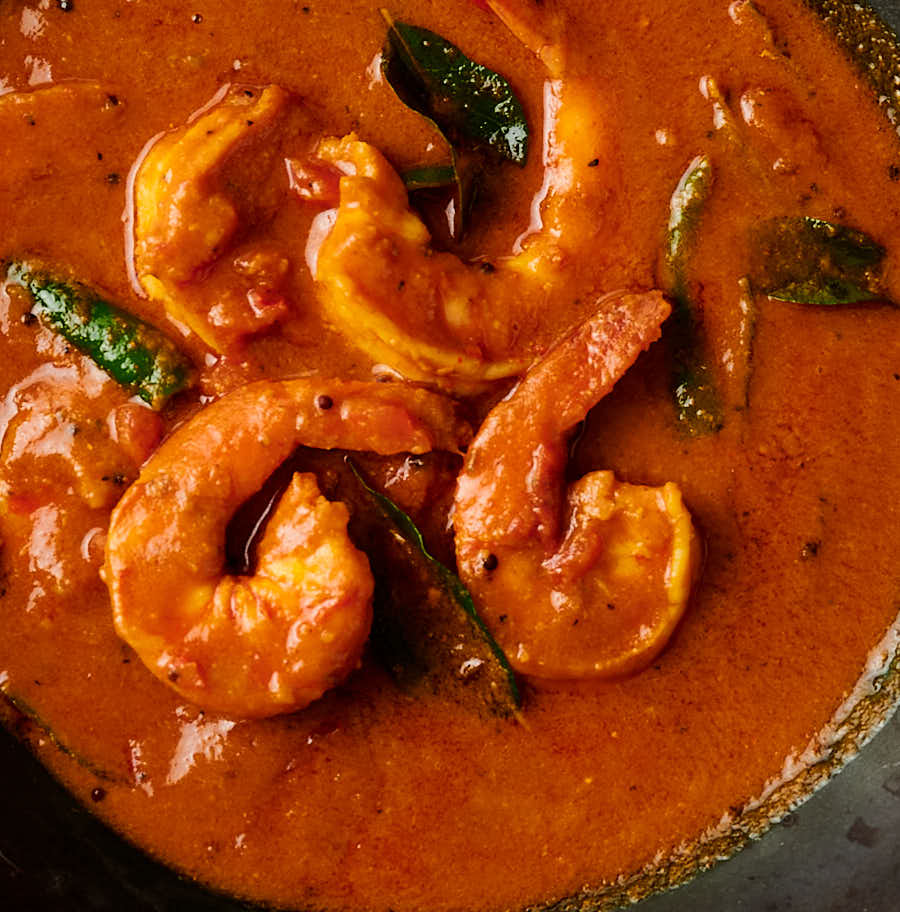 Close-up of shrimp in rich South Indian gravy