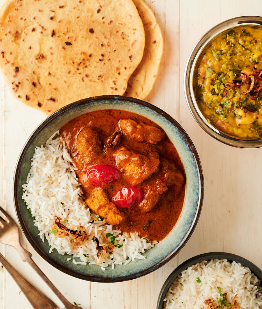 Chicken rogan josh served with rice, dal and chapatis.