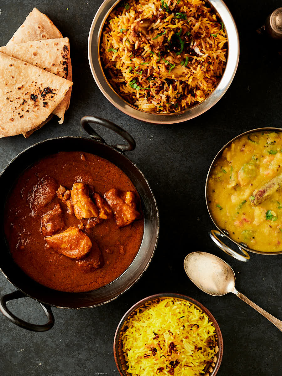 Table scene - chicken pathia, rice and tarka dal from above.