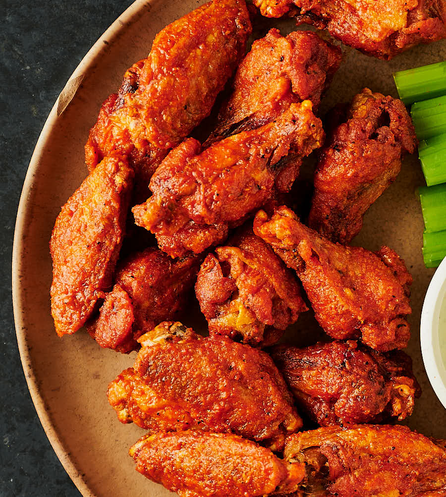 A pile of crispy vindaloo chicken wings from above.