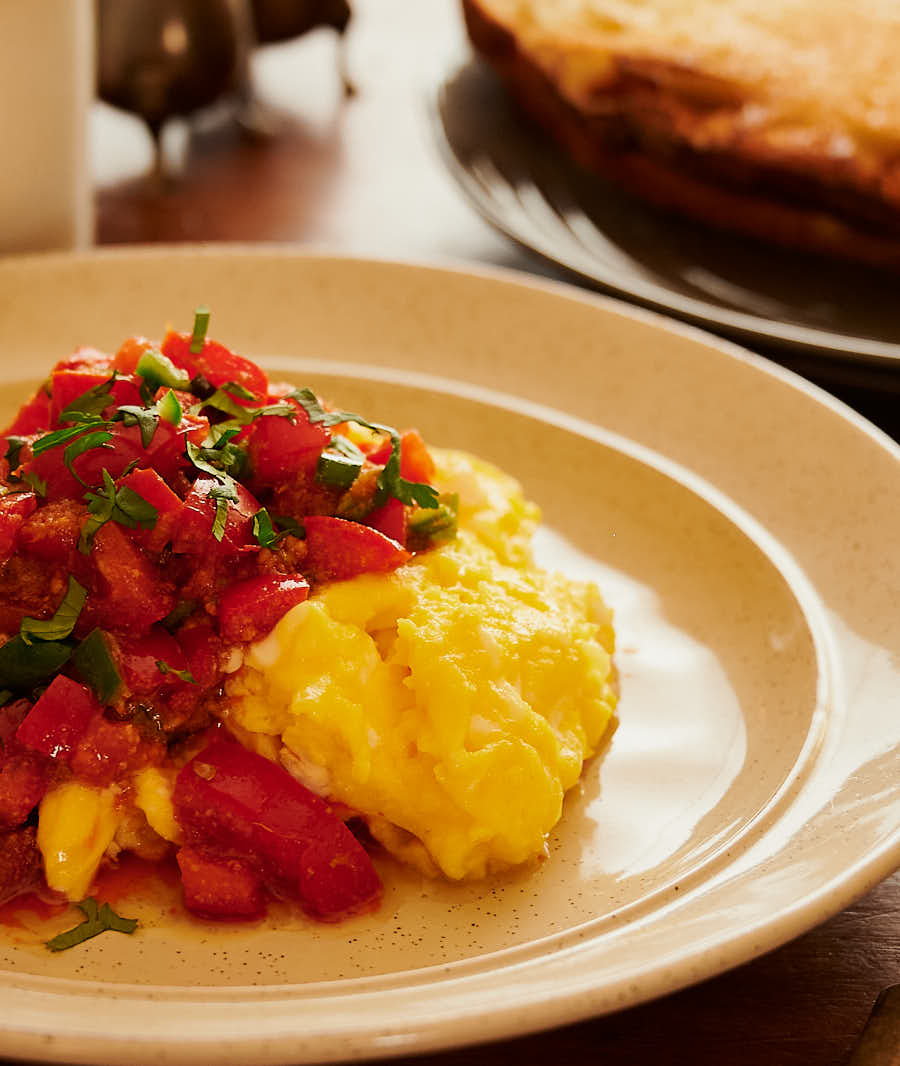 Close up of tomato masala on eggs