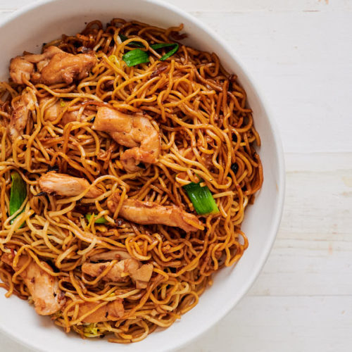 Bowl of chicken chow mein with black beans from above.