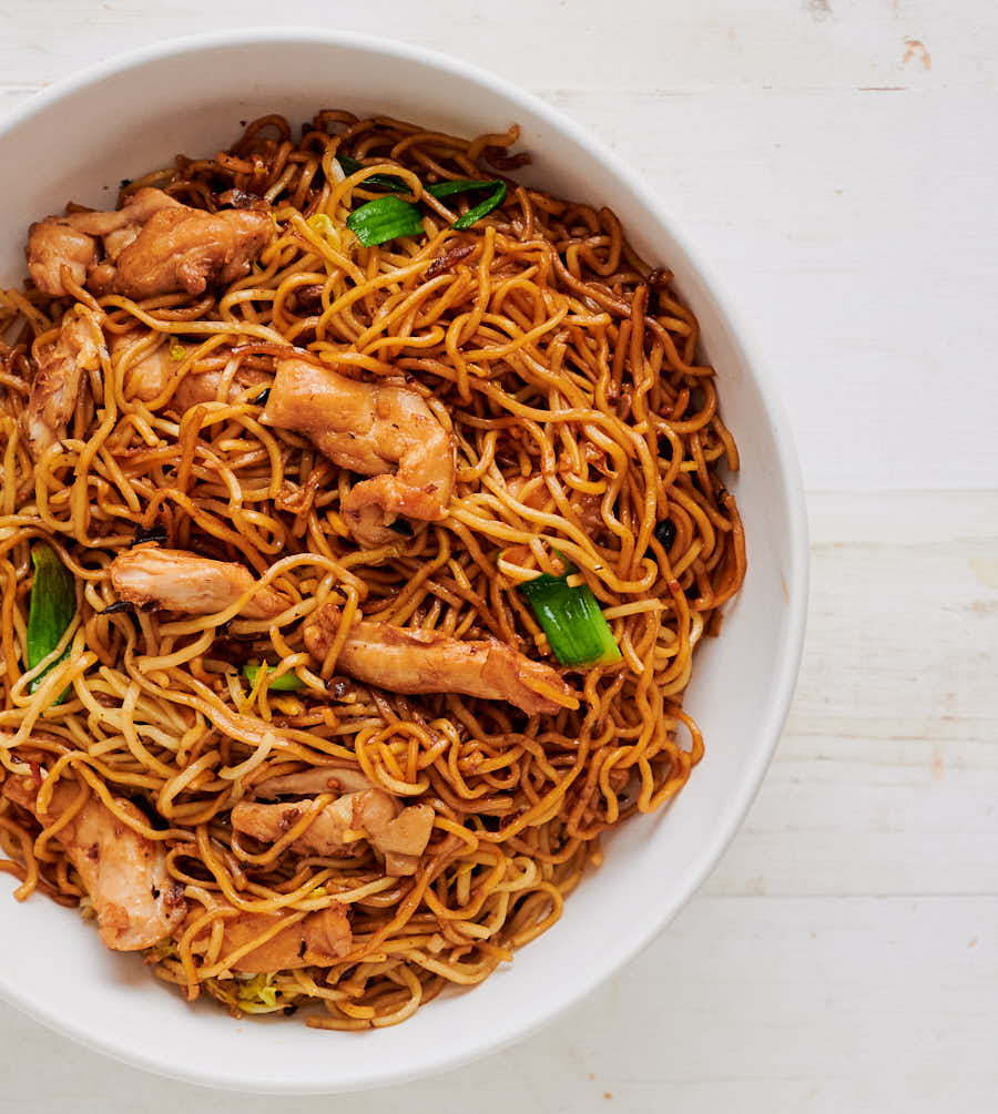 Bowl of chicken chow mein with black beans from above.