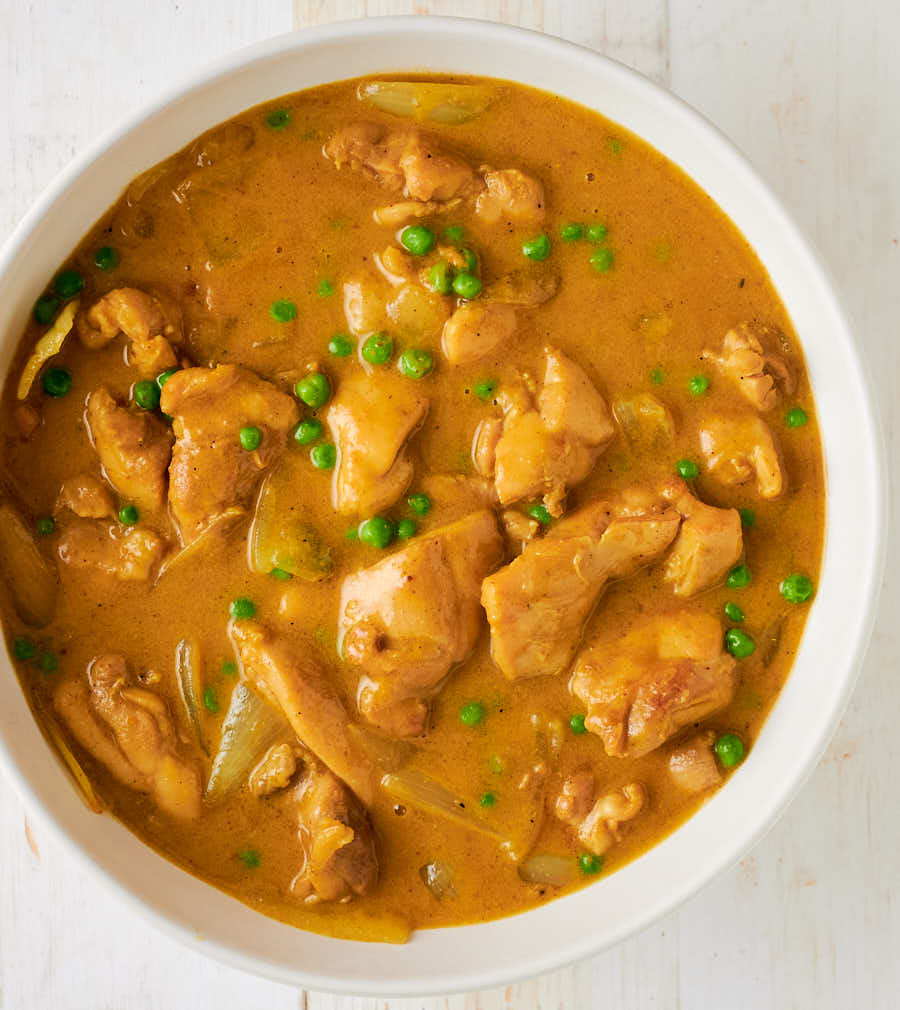 Chinese chicken curry in a serving bowl from above.