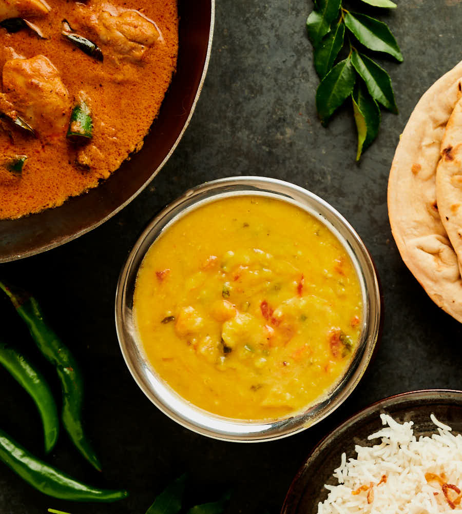 simple dal, curry, chapatti and rice table scene