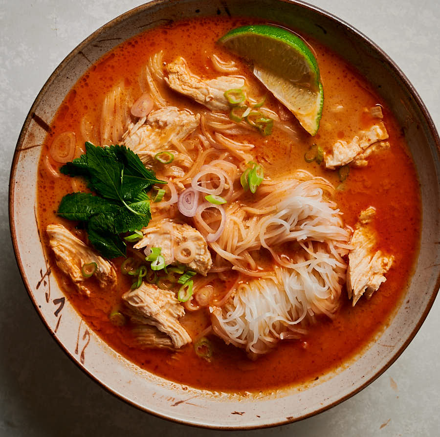 Bowl of tom kha gai noodle soup from above.